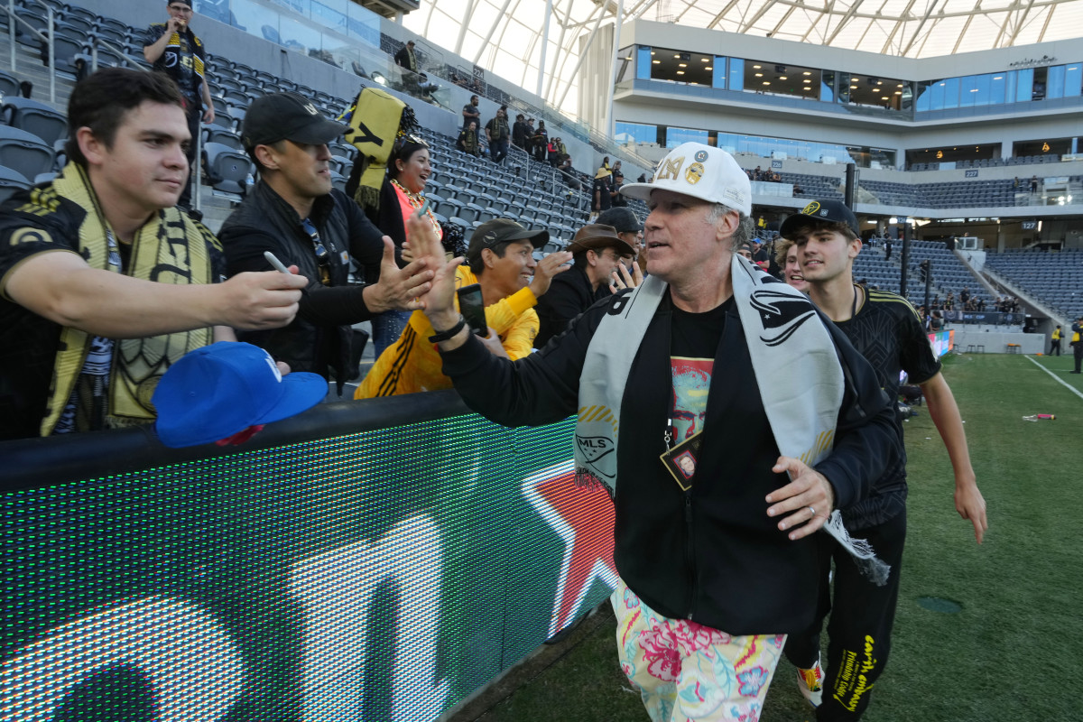 Actor Will Ferrell high fives fans after LAFC’s win